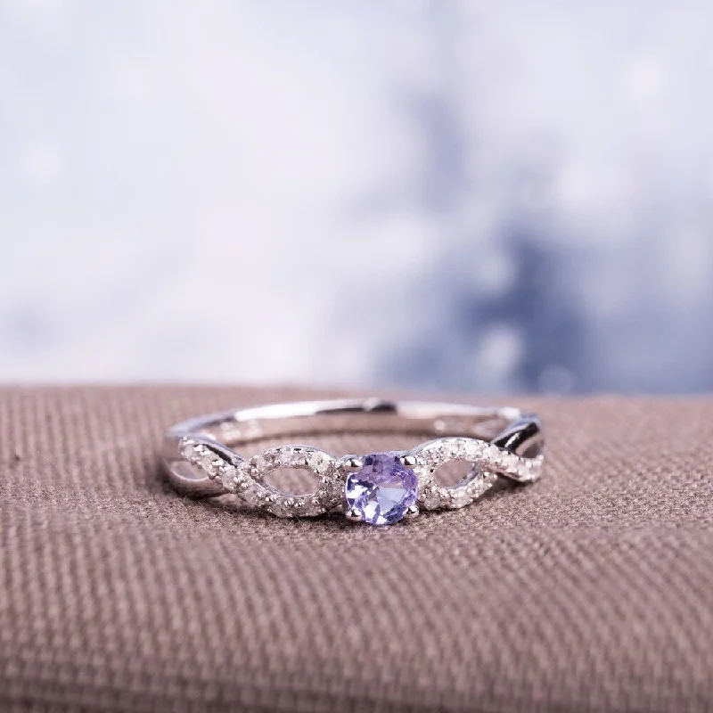 Miadora Sterling Silver Tanzanite and 1/10ct TDW Diamond Ring (H-I, I2-I3)